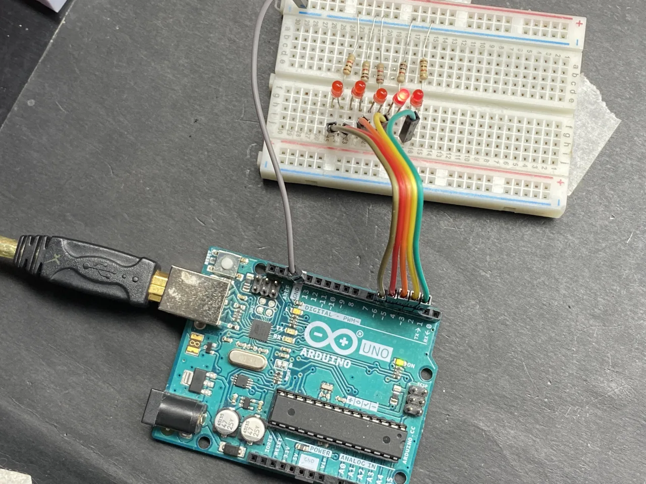 5 leds on breadboard with resistor shown connected to Arduino UNO