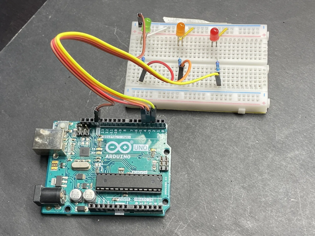 red, green and yellow leds on bread board for traffic light project