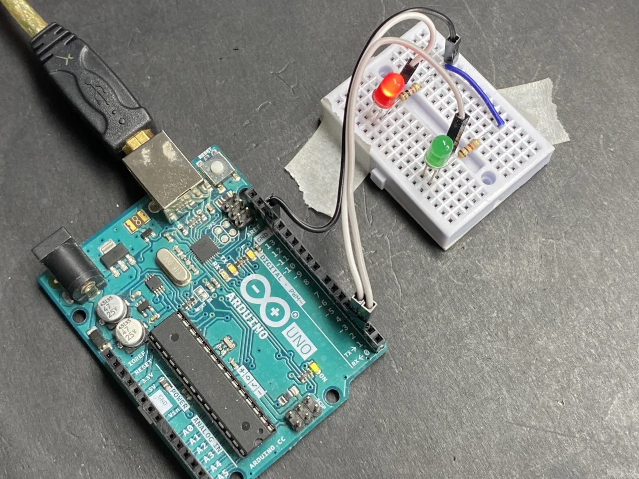 two LEDs with resistor on breadboard connected to Arduino